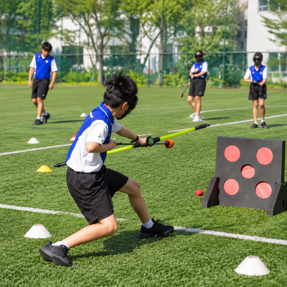 Students playing Archery Tag during a Momentum Academy programme in Singapore