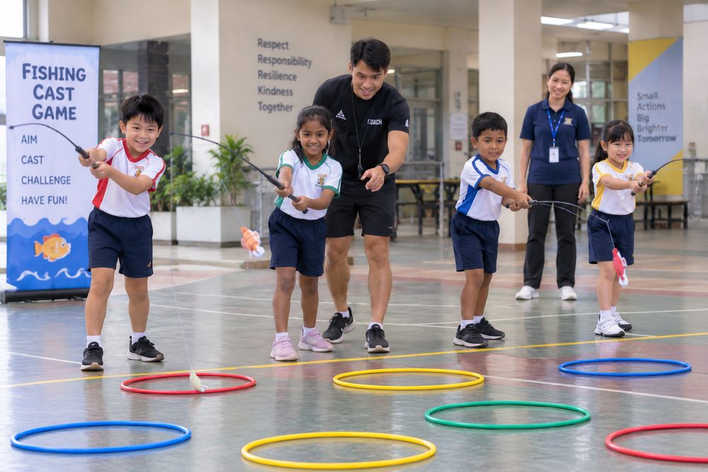 Students playing Fishing Cast Game during a Momentum Academy programme in Singapore