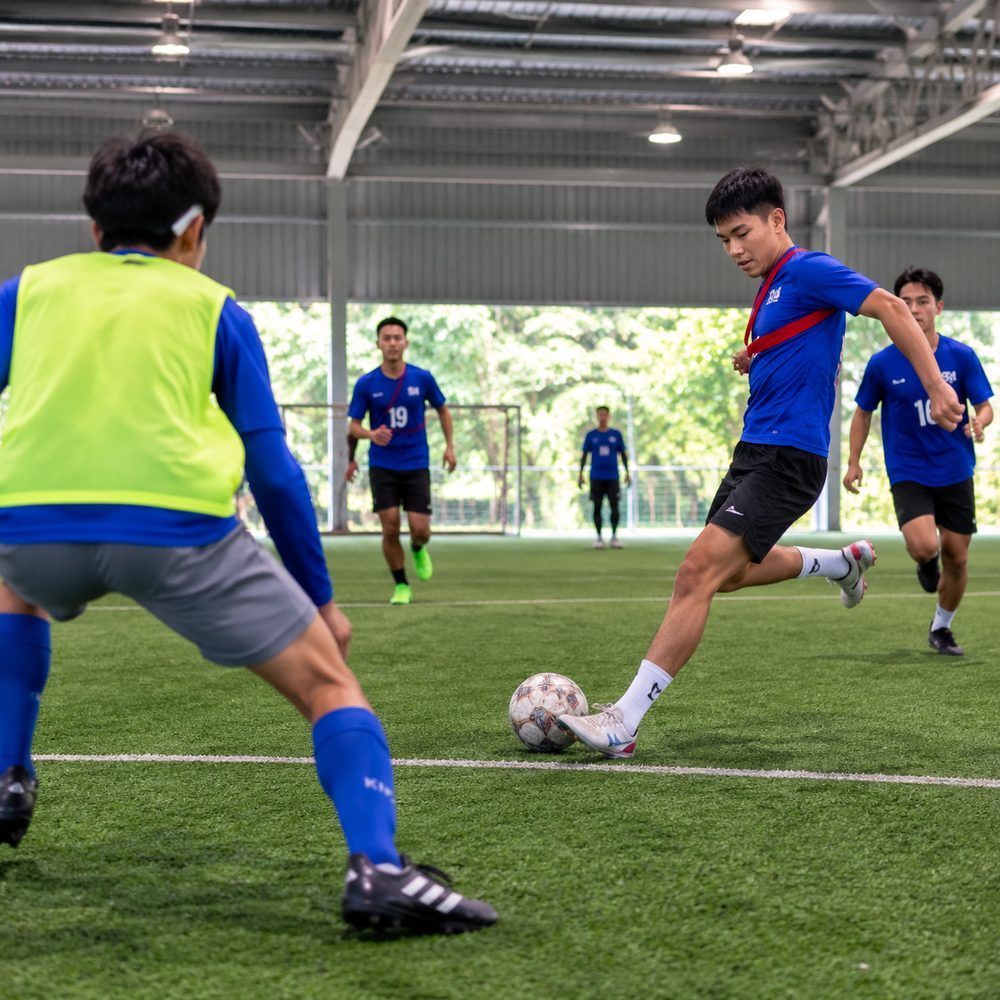 Secondary school students playing in a futsal tournament during post-exam activities in Singapore