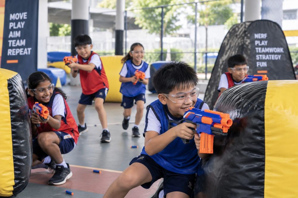 Students playing Nerf Play during a Momentum Academy programme in Singapore