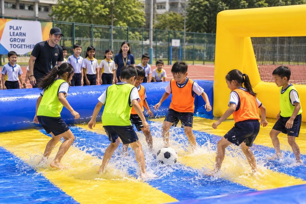 Students playing Water Soccer during a Momentum Academy programme in Singapore